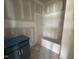 A partially finished bathroom featuring a blue vanity and tub/shower combo at 125 Summerlin Dr, Clayton, NC 27527