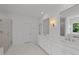 Bathroom with double vanity, marble countertops, and a glass-enclosed shower at 125 Summerlin Dr, Clayton, NC 27527