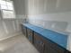 Bathroom featuring gray cabinets with sleek hardware and countertop space at 125 Summerlin Dr, Clayton, NC 27527