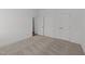 Carpeted bedroom with closet space, neutral walls, and white trim throughout at 125 Summerlin Dr, Clayton, NC 27527