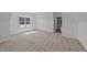Large, brightly lit bedroom features neutral carpet, closet and interior door at 125 Summerlin Dr, Clayton, NC 27527