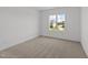 Bedroom with bright sunlight coming in from the windows, and neutral color carpet at 125 Summerlin Dr, Clayton, NC 27527