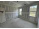 A bright bedroom with two windows offering picturesque views and natural light at 125 Summerlin Dr, Clayton, NC 27527