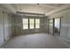 Bedroom with tray ceiling and large windows at 125 Summerlin Dr, Clayton, NC 27527