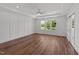 Bedroom featuring hardwood floors and a cozy fireplace at 125 Summerlin Dr, Clayton, NC 27527