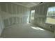 Well-lit bedroom featuring windows and potential for a relaxing retreat at 125 Summerlin Dr, Clayton, NC 27527