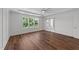 Bedroom featuring hardwood floors and a view to back yard at 125 Summerlin Dr, Clayton, NC 27527