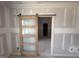 Bedroom with a sliding glass door that leads into another room at 125 Summerlin Dr, Clayton, NC 27527