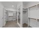 Spacious walk-in closet features ample shelving, hanging rods and full-length mirror at 125 Summerlin Dr, Clayton, NC 27527