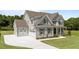 Elegant two-story home with attached garage, gray siding, and a well-maintained lawn surrounded by trees at 125 Summerlin Dr, Clayton, NC 27527