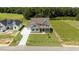 This aerial view shows the well maintained lawn and beautiful facade of this charming house at 125 Summerlin Dr, Clayton, NC 27527