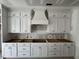 Custom kitchen cabinets featuring white cabinets, drawers, and space for appliances at 125 Summerlin Dr, Clayton, NC 27527