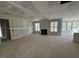 Spacious living room featuring a fireplace and abundant natural light from large windows at 125 Summerlin Dr, Clayton, NC 27527