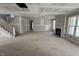 Expansive living room with a staircase, fireplace, and large windows offering ample natural light at 125 Summerlin Dr, Clayton, NC 27527