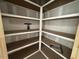 Large pantry with ample custom wood shelving and storage space at 125 Summerlin Dr, Clayton, NC 27527