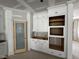 Custom pantry with glass door and built-in shelves and storage at 125 Summerlin Dr, Clayton, NC 27527