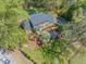 Aerial view of a well-maintained home with a manicured lawn, vibrant landscaping, and mature trees at 1302 Hermitage Rd, Sanford, NC 27330