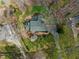 Aerial view of landscaped yard and home with curved driveway at 1302 Hermitage Rd, Sanford, NC 27330