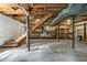 Unfinished basement with exposed beams, storage shelving and stairs at 1302 Hermitage Rd, Sanford, NC 27330