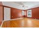 Bedroom with hardwood floors, ceiling fan, and natural light at 1302 Hermitage Rd, Sanford, NC 27330