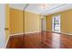 Bright bedroom with hardwood floors, white trim, and a large window for plenty of natural light at 1302 Hermitage Rd, Sanford, NC 27330
