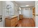 Walk-in closet with storage shelving and hardwood floor at 1302 Hermitage Rd, Sanford, NC 27330
