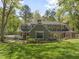 Lush front lawn and manicured landscaping add to the curb appeal of this lovely house at 1302 Hermitage Rd, Sanford, NC 27330