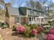 Charming two-story home with brick and siding and lovely landscaping including azaleas at 1302 Hermitage Rd, Sanford, NC 27330