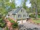 Charming two-story home with a convenient two-car garage, brick walkway, and beautifully landscaped surroundings at 1302 Hermitage Rd, Sanford, NC 27330