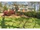 Attractive two-story home with a mix of trees and lush landscaping on a sprawling lot at 1302 Hermitage Rd, Sanford, NC 27330