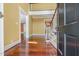 Bright, spacious foyer boasts hardwood floors and a staircase with natural light creating a welcoming entry at 1302 Hermitage Rd, Sanford, NC 27330