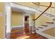 Bright, spacious foyer boasts hardwood floors and a staircase, bathed in natural light creating a welcoming entry at 1302 Hermitage Rd, Sanford, NC 27330