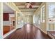 Bright hallway with hardwood floors, ceiling fan, and access to multiple rooms at 1302 Hermitage Rd, Sanford, NC 27330