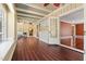 Bright hallway with hardwood floors, ceiling fan, and access to multiple rooms at 1302 Hermitage Rd, Sanford, NC 27330