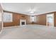 Spacious living room featuring a cozy fireplace and two windows at 1302 Hermitage Rd, Sanford, NC 27330