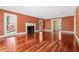 Bright living room featuring hardwood floors and fireplace, great for gatherings at 1302 Hermitage Rd, Sanford, NC 27330