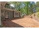 Charming brick patio with brick wall offers an inviting outdoor space for relaxation and entertaining at 1302 Hermitage Rd, Sanford, NC 27330