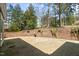 Brick patio featuring a brick retaining wall and views of the yard at 1302 Hermitage Rd, Sanford, NC 27330