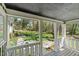 Covered porch overlooking a beautiful landscaped backyard at 1302 Hermitage Rd, Sanford, NC 27330