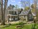 View of rear exterior showing siding, porch and mature landscaping at 1302 Hermitage Rd, Sanford, NC 27330