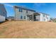 Spacious backyard featuring a screened-in porch and ample space for outdoor enjoyment, ideal for entertaining at 139 Pronghorn Deer Ct, Garner, NC 27529