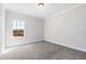 A bright bedroom with a large window and carpeted flooring at 139 Pronghorn Deer Ct, Garner, NC 27529