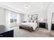 Spacious bedroom with a tray ceiling and ample natural light at 139 Pronghorn Deer Ct, Garner, NC 27529