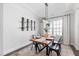 Formal dining area with modern lighting and decor, perfect for entertaining at 139 Pronghorn Deer Ct, Garner, NC 27529