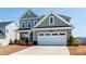 Beautiful two-story home with a well-manicured lawn, a two car garage and attractive curb appeal at 139 Pronghorn Deer Ct, Garner, NC 27529