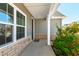 Charming covered front porch with stone accents and well-maintained landscaping, offering a welcoming entrance at 139 Pronghorn Deer Ct, Garner, NC 27529