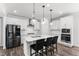 New kitchen featuring stainless steel appliances, white cabinets, pendant lights and island seating at 139 Pronghorn Deer Ct, Garner, NC 27529