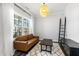 Cozy living room with plush sofa, accent rug, and natural light at 139 Pronghorn Deer Ct, Garner, NC 27529