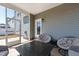 Cozy screened-in porch with comfortable seating and view of the backyard at 139 Pronghorn Deer Ct, Garner, NC 27529