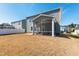 View of a large screened-in porch, offering a perfect outdoor retreat and a spacious backyard at 139 Pronghorn Deer Ct, Garner, NC 27529